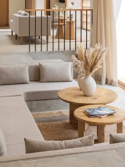 A closer look at the sunken living area in the House of Basho. The built-in seating and low-profile tables enhance the grounded, relaxed feel, making it a perfect space for informal gatherings.