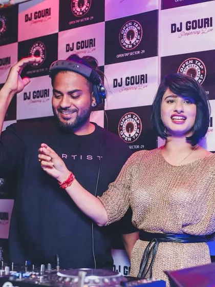 All smiles behind the decks with DJ Gouri. A great DJ partnership means feeding off each other's energy to create an even better experience for the crowd.