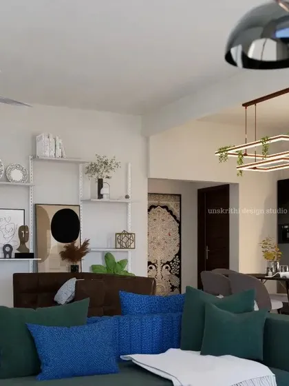 A living room should feel alive. For this renovation, we preserved the room's generous size but injected personality with bold colors and custom shelving. The result is an open, sophisticated space that encourages family connection and showcases their unique collection of art and heirlooms.