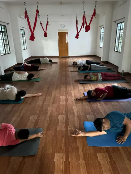 A 6 am relaxing Yin Yoga session. Students hold a side-lying pose to gently open the body and calm the mind.