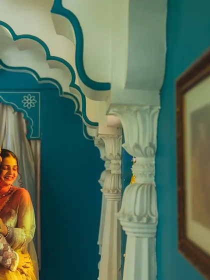 An intimate embrace within a beautifully designed alcove. Even in a grand palace, I look for these small, colorful corners to capture quiet, romantic moments that feel personal and secluded.