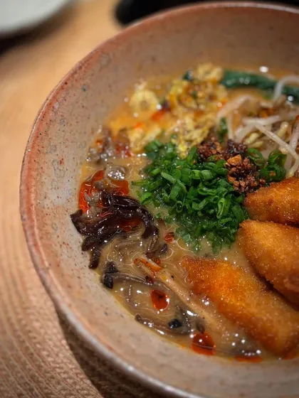 A close-up of a delicious ramen served in our Shino glazed bowl. The rustic, warm tones of the glaze make the vibrant colors of the food pop.