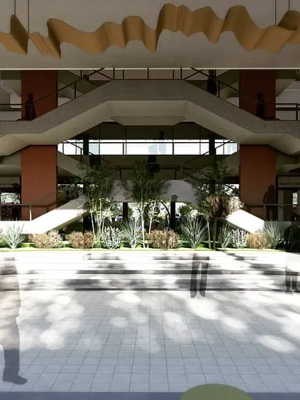 This render shows the proposed grand atrium for the BGS School of Architecture. The design features a central bifurcating staircase and multi-level open spaces to encourage student interaction and create a dynamic hub for learning.