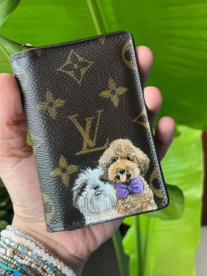 A different angle of the custom LV card holder with the two dog portraits.