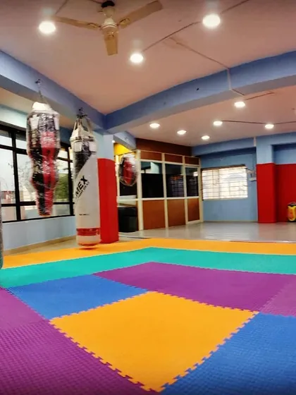 This is our arena. The place where you will face your fears and find your strength. Our gym is fully equipped with punching bags, matted floors, and all the gear you need to transform yourself. All that's missing is you.