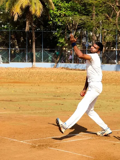A bowler in full flow during a practice match. These sessions are crucial for building rhythm and confidence.