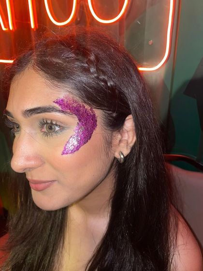 A vibrant magenta glitter crescent design. The bold color makes a huge impact and is perfect for standing out in a crowd.