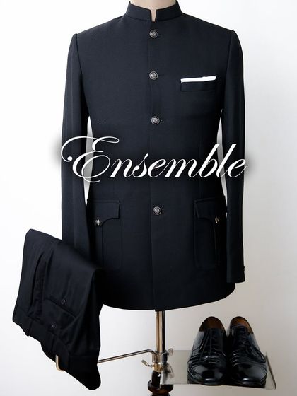 A complete ensemble featuring a classic black Jodhpuri suit, trousers, and shoes. We ensure every detail works in cohesion to create a perfectly blended, sophisticated look for the wedding season.