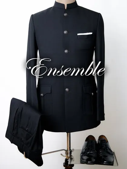 A complete ensemble featuring a classic black Jodhpuri suit, trousers, and shoes. We ensure every detail works in cohesion to create a perfectly blended, sophisticated look for the wedding season.