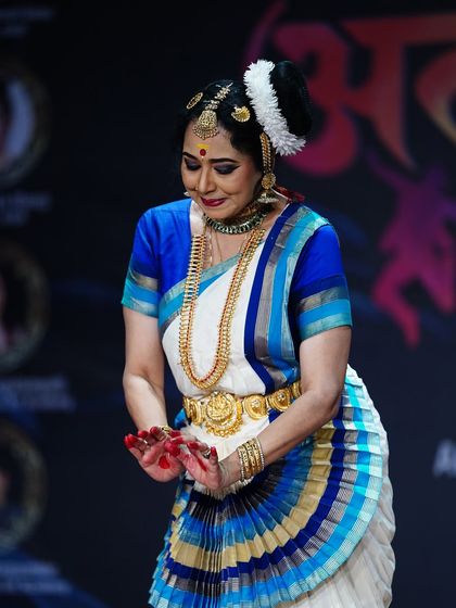 A captivating moment from Smt. Gopika Varma's Mohiniyattam recital. Her mastery over abhinaya (expression) is evident in every subtle glance and gesture.