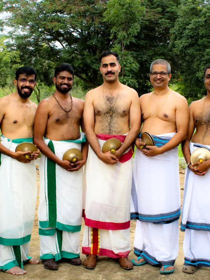 A group photo of our proud Ilathalam artists, the team that provides the shimmering, metallic pulse to our Melam.