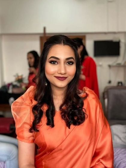 Subtle yet elegant for this bridesmaid. A bold lip and clean eye makeup create a sophisticated look that's perfect for a Catholic wedding ceremony.