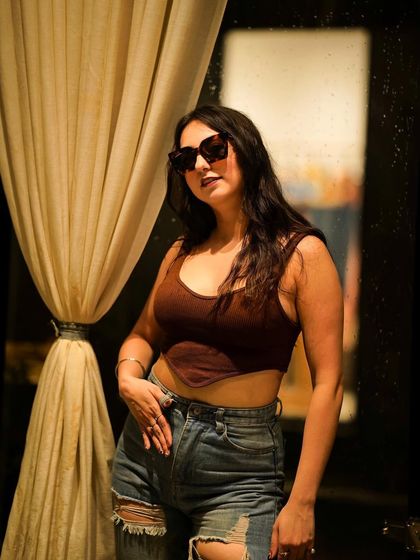 A confident pose showing the full casual outfit.