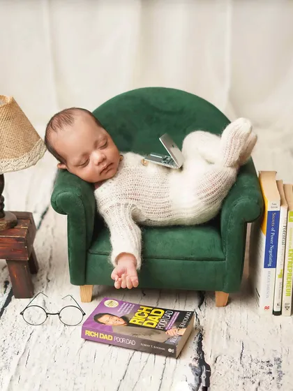 Another take on the 'baby boss' theme, with the laptop fallen on his lap as he sleeps. It's these funny details that make themed shoots so memorable.