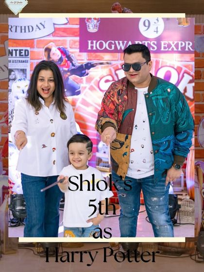 The birthday boy, Shlok, dressed as Harry Potter and waving a wand with his family. I love seeing families get into the spirit of the theme.