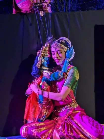 A puppeteer and a puppet share an embrace in a poignant scene from 'Poetry in Puppetry'. This image captures the deep emotional connection that defines our performances.