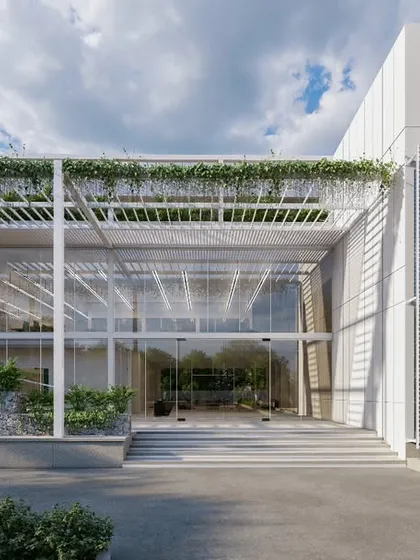 The entrance to the MOSPO office building in Bangalore demonstrates our vision for modern workplaces. We integrated extensive glazing, clean structural lines, and natural elements like water features and climbing greenery to create a transparent, light-filled, and inspiring environment for creativity and collaboration.