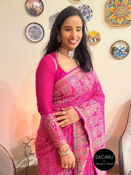 An elegant full-sleeve blouse designed for a beautiful georgette bandini Benarasi saree, featuring a keyhole back design.