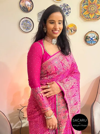 An elegant full-sleeve blouse designed for a beautiful georgette bandini Benarasi saree, featuring a keyhole back design.