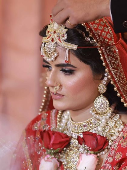 A candid moment during the wedding ceremony. My makeup is designed to withstand tears, sweat, and long hours, ensuring the bride looks perfect through every ritual.