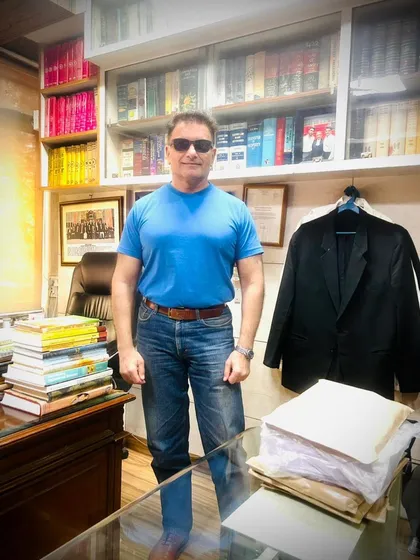 A moment in my office. The stacks of files and books represent years of dedication to my clients and the field of immigration law.