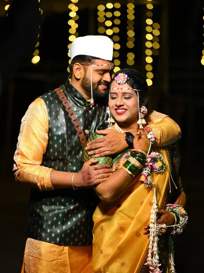 The warmth and happiness of a Haldi ceremony, perfectly captured. The bride's floral accessories add a fresh, natural elegance to this special moment.