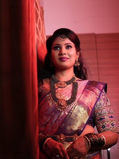 Another beautiful portrait of Aarthi. Her makeup is glamorous and perfectly suited for an evening reception.