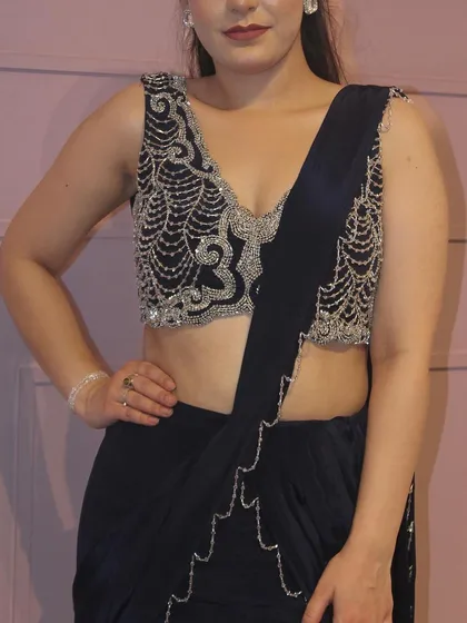 Another close-up of the V-neck embroidered blouse, showing the detailed craftsmanship.