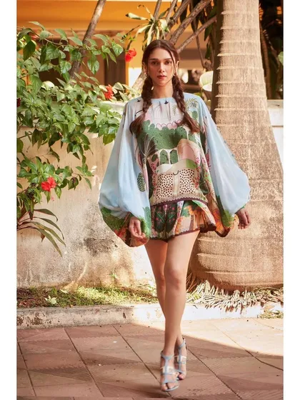 A walking shot of the Limerick set, showing the movement of the oversized top and matching shorts.