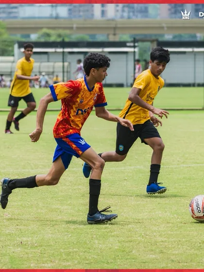 A player shields the ball during a competitive drill. We train for real match situations.