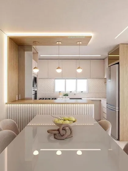 This open-concept kitchen and dining area is a testament to our 3D visualization process, allowing you to see your dream space before we build. Notice the seamless integration of the breakfast counter, ambient lighting, and fluted panel details that add texture and warmth.