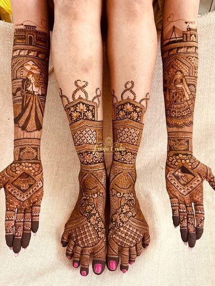 A full bridal look for an NRI bride from San Francisco, featuring custom skyline mehendi on her arms and complementary patterns on her feet.