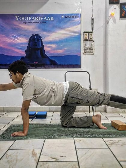 This student is practicing Dandayamana Bharmanasana (Balancing Table Pose). It is an excellent asana for building core strength and improving balance, which is fundamental for overcoming anxiety and building confidence.