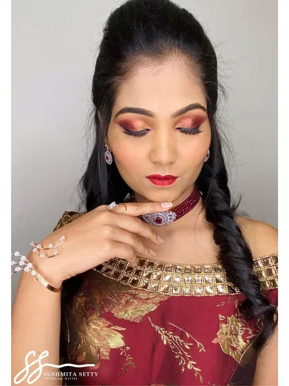 A detailed shot of a sangeet makeup look, focusing on the warm, shimmery eyeshadow blend and a classic red lip. This kind of close-up shows how I ensure every detail is perfect for high-resolution photography.