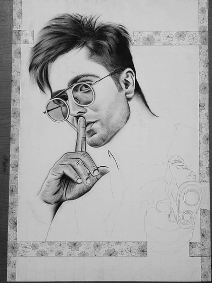 The 90-hour process behind my photorealistic pencil drawing of Harrdy Sandhu. Notice the detail in the sunglasses reflection and the texture of the shirt.