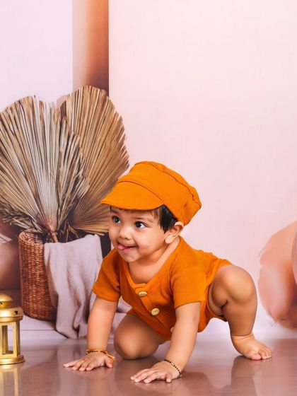 On the move. This crawling shot captures the adventurous spirit of this little one as he explores the earthy, bohemian-styled studio.