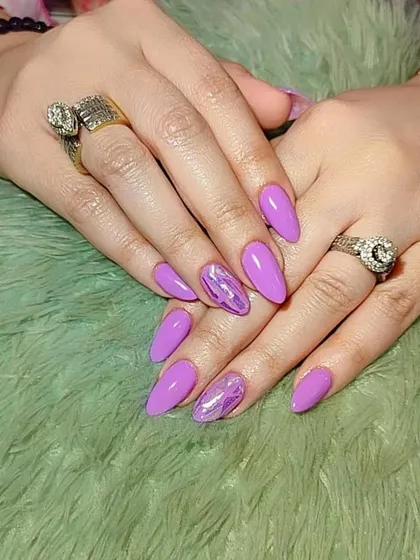 A lovely set of purple nails with a marbled, shimmery accent nail.