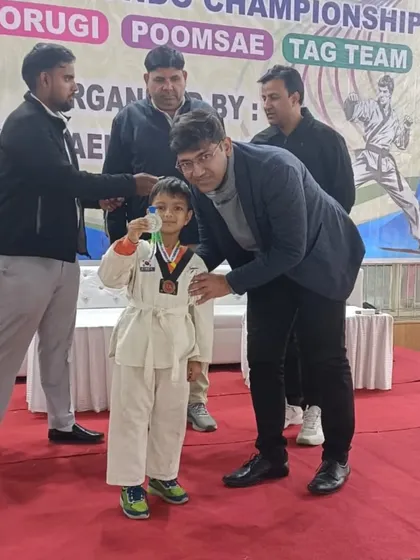 A young champion receiving his medal at the Late Jai Kishan Memorial Taekwondo Championship in New Delhi. We start them young.