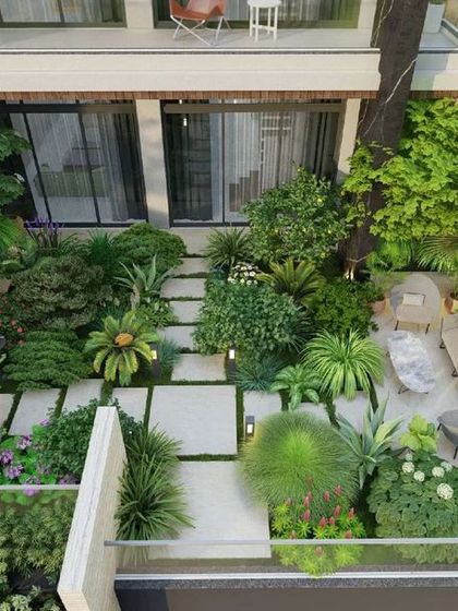 An aerial view of the landscape design for 'The Garden House', showing the thoughtful arrangement of pathways, seating areas, and dense greenery to create a private oasis.