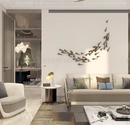 Another angle of the DLF drawing room, showing the seamless flow into the dining area, which is visible in the background. The design prioritizes an open and social atmosphere.