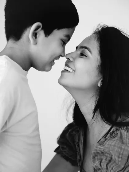 A beautiful black and white close-up. This intimate nose-to-nose portrait captures the deep, unspoken connection between a mother and her child.