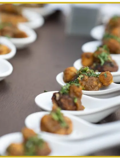 A mini Chole Tikki starter, elegantly served on tasting spoons. Each bite is a masterpiece of authentic Indian flavors, perfect for kicking off a celebration.