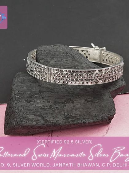 Another view of the patterned marcasite bangle, showing the secure clasp and the beautiful craftsmanship.