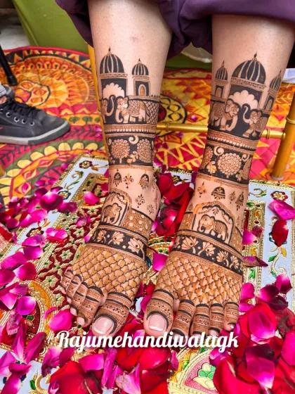 This design features palace domes and elephants on the feet, surrounded by a carpet of rose petals. It's a truly royal look for a bride's feet.