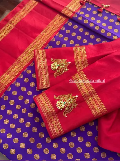 Our signature jewellery concept on a vibrant red blouse. The sleeves are adorned with peacock-shaped kemp stone pendants, perfectly matching the purple and gold brocade skirt.