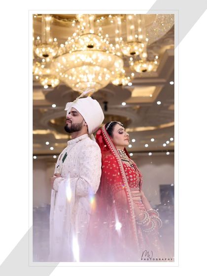 An artistic shot of the bride and groom. The dramatic lighting and pose create a very memorable and modern wedding photo.