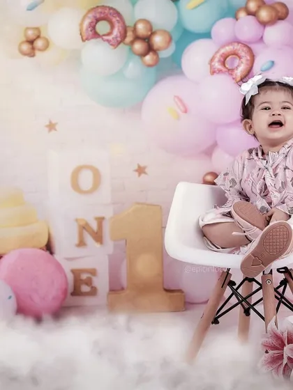 A candid moment of laughter during a first birthday session. We aim to capture the full range of emotions, from curiosity to pure, uninhibited joy.
