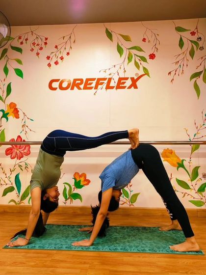 Another angle of our double downward dog, highlighting the alignment and trust required to hold the pose steady.