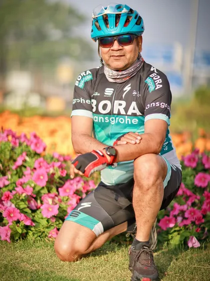 Another member posing amidst flowers. Our rides are a feast for the eyes.