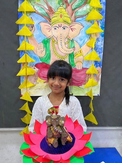 This student created a beautifully decorated Ganesha, complete with a paper lotus base, showcasing her crafting skills.